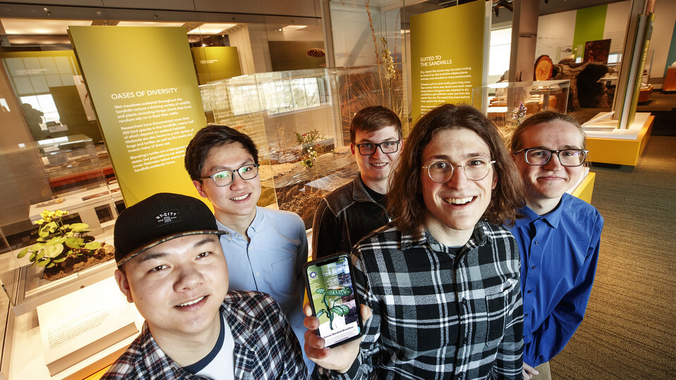 A team of students from computer science and engineering built a virtual reality app to enhance the information at the Nebraska State Museum's new Cherish Nebraska exhibit. The team is comprised of (from left) Ziyuan Ye, JunShen Ban, Brandon Heuttner, Mat