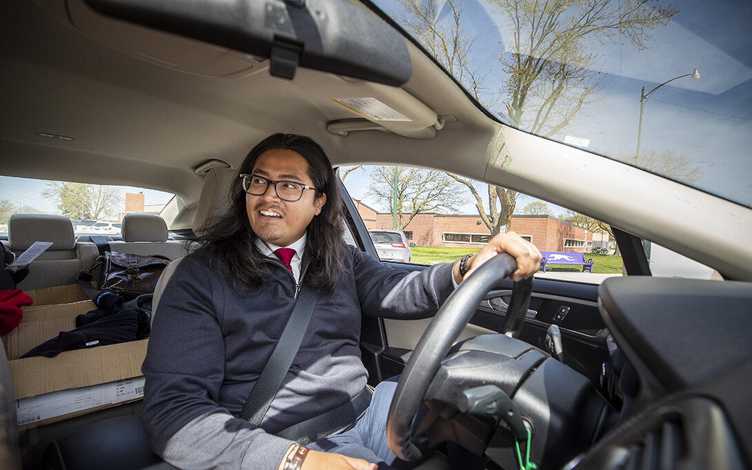 Having completed his April 23 presentation at Minden High School, Nebraska recruiter Abel Covarrubias smiles as he travels to Burwell for his next chat with potential Huskers.