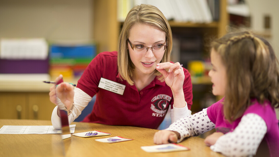  A master's student works one-on-one with a child through a Department of Special Education and Communication Disorders program. The department recently received a $1 million grant to train at least 30 master's level students to assist youth who are deaf or hard of hearing.