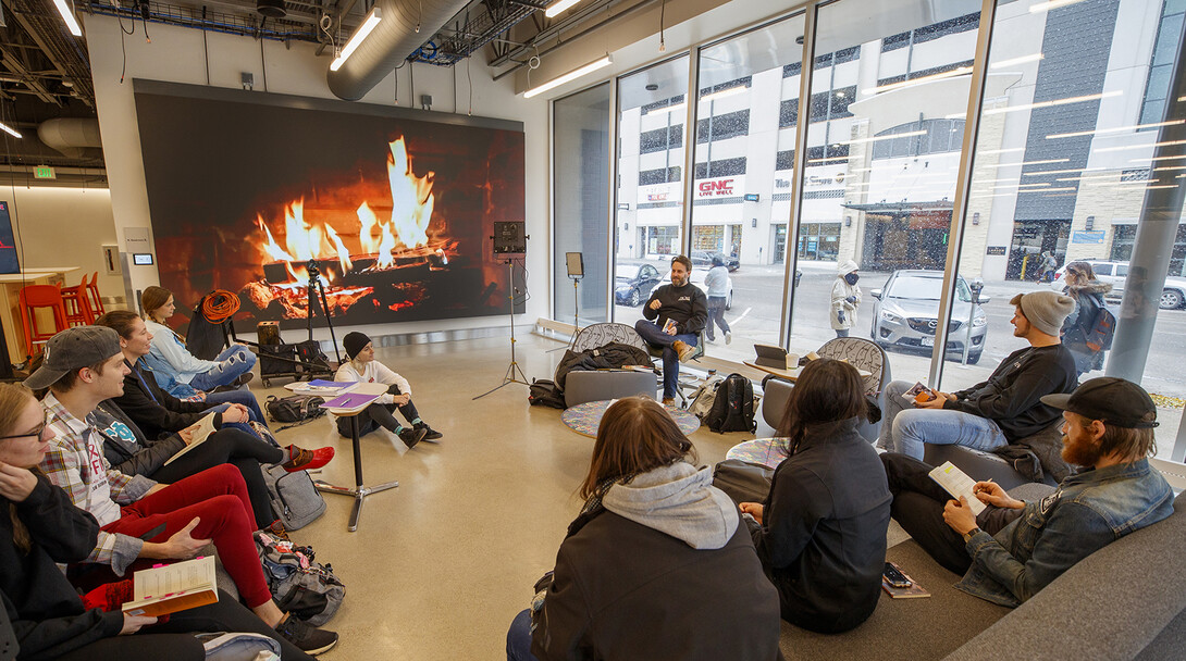 With a fireplace in the background, faculty Jesse Fleming leads a discussion in a Visual Expression Studio course in Nebraska’s Johnny Carson Center for Emerging Media Arts. The facility, which is in its first semester of use, will be celebrated Nov. 15-17.