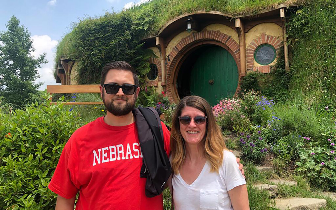 Nebraska's Alex Gordon-Stotz poses with a co-worker on the Hobbiton movie set in New Zealand.