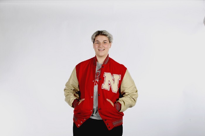 Emily Cheramie poses with her Husker letter-winner's jacket.