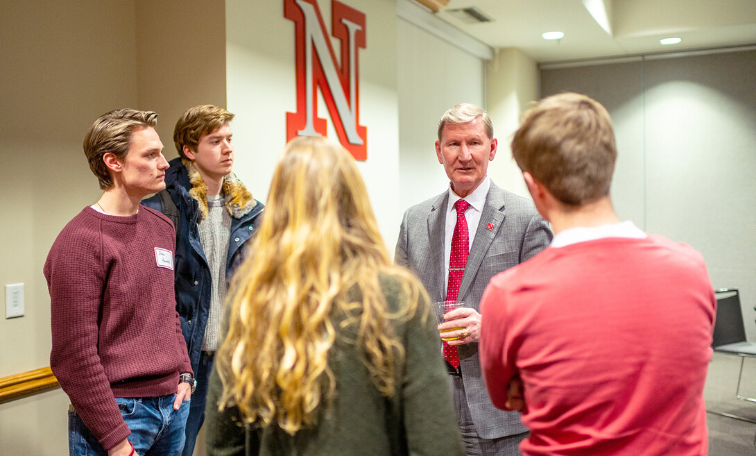 Ted Carter talks with students during a dinner on Jan. 16. The event featured leaders from recognized student organizations, including the Association of Students of the University of Nebraska.
