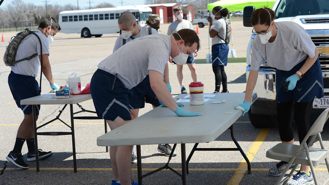 Nebraska National Guard members with the 155th Medical Group prepare a worksite for COVID-19 testing in Grand Island on April 7. The medical group, which includes Gabe Chase, is part of the Chemical, Biological, Radiological, Nuclear and Explosive Enhanced Response Force Package team. The team is an joint-force unit between the Army and Air National Guard and specializes in search and extraction, decontamination, medical, facilities search and rescue, and joint incident site communications comma