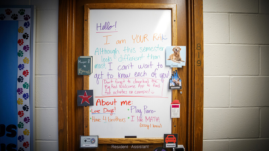 A first day welcome message adorns the door of the Harper Hall 8th floor resident assistant.