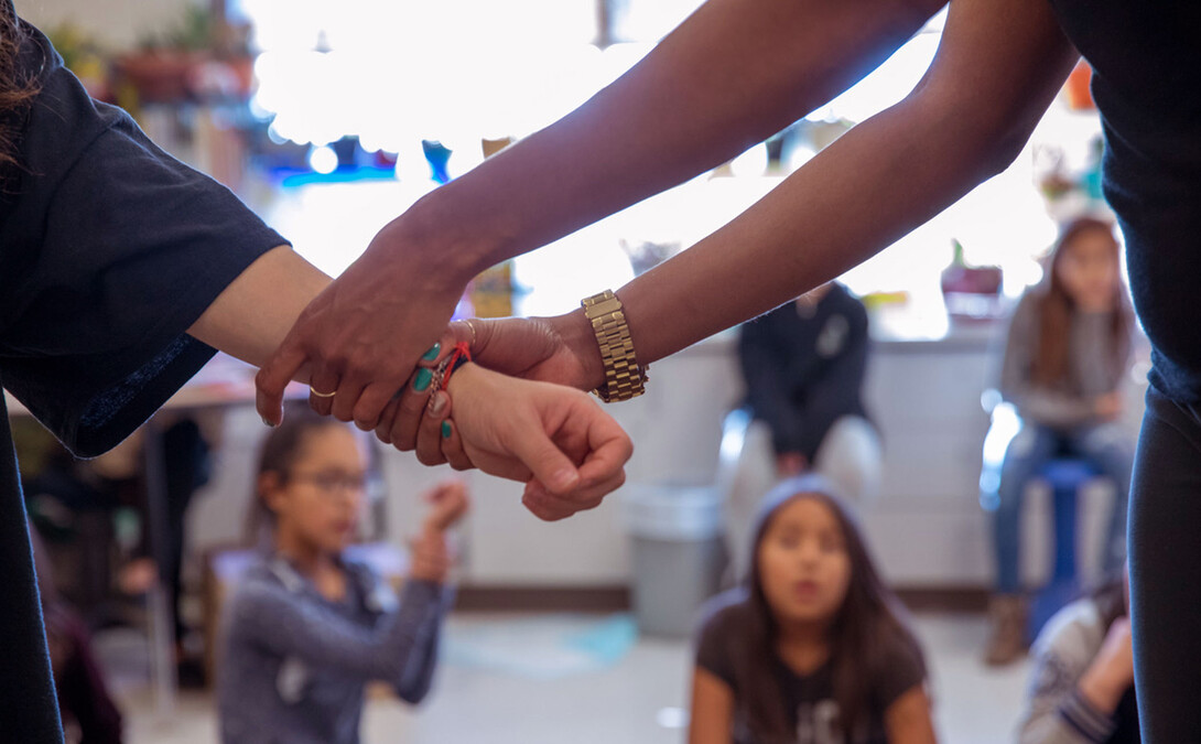 Instructors work with children on a Native American reservation as part of the IMpower violence prevention program. (Photo courtesy of Brooke Duthie Photography)