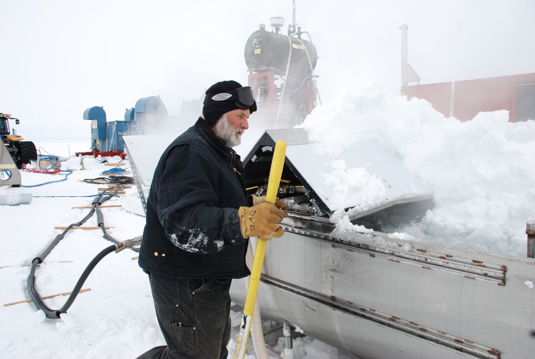 Nebraska's Dennis Duling examines the melt tank used for the Nebraska designed, hot-water drill that will be used to tap into