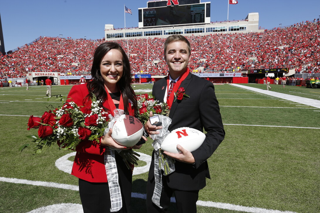 Homecoming queen and king Maggie Schneider and Tommy Olson appear at halftime of the Nebraska-Southern Miss game.