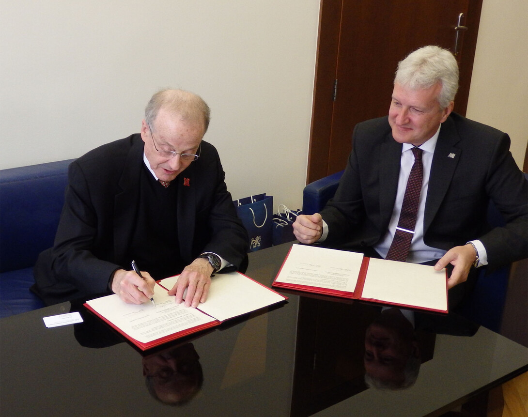 UNL Chancellor Harvey Perlman (left) and Czech Technical University Rector Petr Konvalinka sign a memorandum of understanding between the two universities March 21 in Prague.