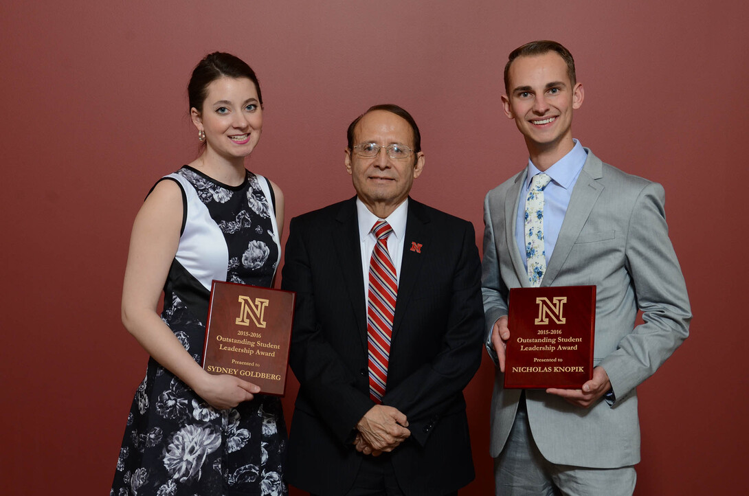 Outstanding Student Leadership Award winners Sydney Goldberg and Nicholas Knopik stand with Juan Franco, vice chancellor for students affairs, during a ceremony April 22.