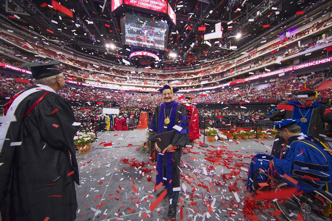 UNL Chancellor Harvey Perlman stands in a confetti shower at the end of the undergraduate commencement ceremony on May 6. The confetti was a special feature to celebrate his final day as chancellor.