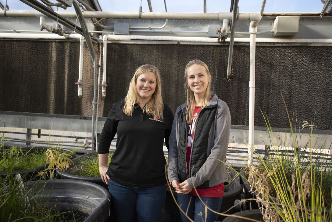 Alexa Davis, (right) graduate student with the School of Natural Resources, and Tiffany Messer, assistant professor and water quality engineer at the University of Nebraska-Lincoln, in the Messer Laboratory surrounded by floating wetland experiments on De