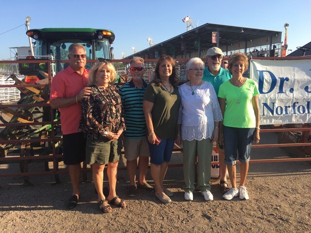 Neva Winter (third from right) poses with her daughters and their husbands July 10 at the Madison County Fair.