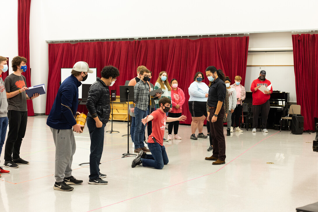 A group of cast members in Mozart's "The Magical Flute" run through music and choreography during a rehearsal Oct. 15.