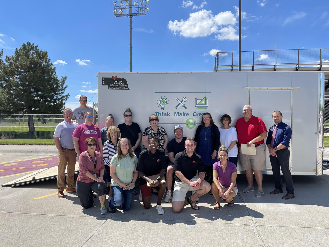 Rural Fellows Victore Mpore (front row, third from left) and Connor Clanton (front row, fourth from left), and the staff of the Valentine Children and Families Coalition, with the largest Think Make Create lab in the state. This summer, the fellows and VCFC staff worked to find sustainable solutions to the decline in licensed and quality daycares in Valentine.