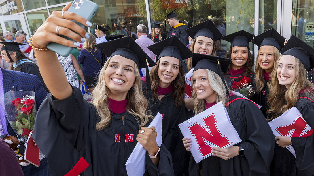 Speech-language pathology master’s graduates gather for a selfie outside Pinnacle Bank Arena following the graduate and professional degree ceremony Aug. 13.