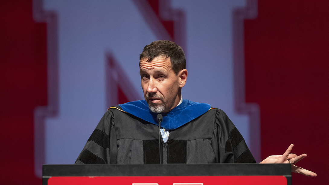 Daniel Linzell, associate dean for graduate and international programs in the College of Engineering and Leslie D. Martin Professor of Civil and Environmental Engineering, gives the keynote address during the graduate and professional degree ceremony Aug. 13 at Pinnacle Bank Arena.