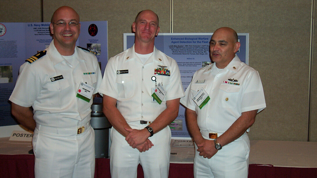 Lt. Cmdr. Mike Boehm and colleagues present a poster highlighting Navy bioweapons detection capabilities in Washington, D.C.