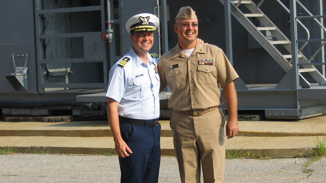 Coast Guard Cmdr. Anthony Popiel (left) and Navy Lt. Cmdr. Mike Boehm
