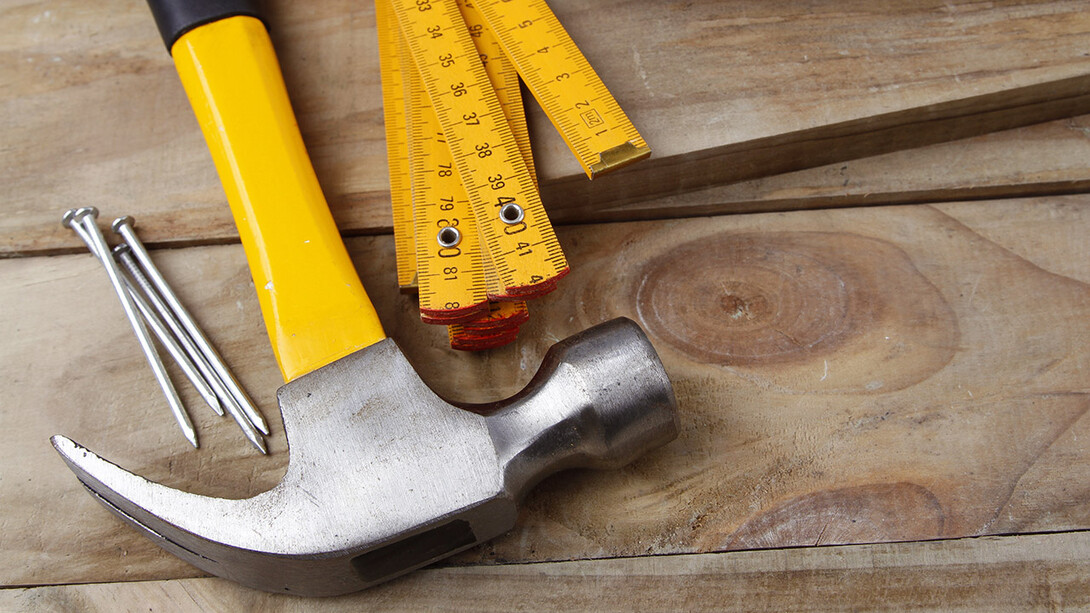 Hammer and nails near boards