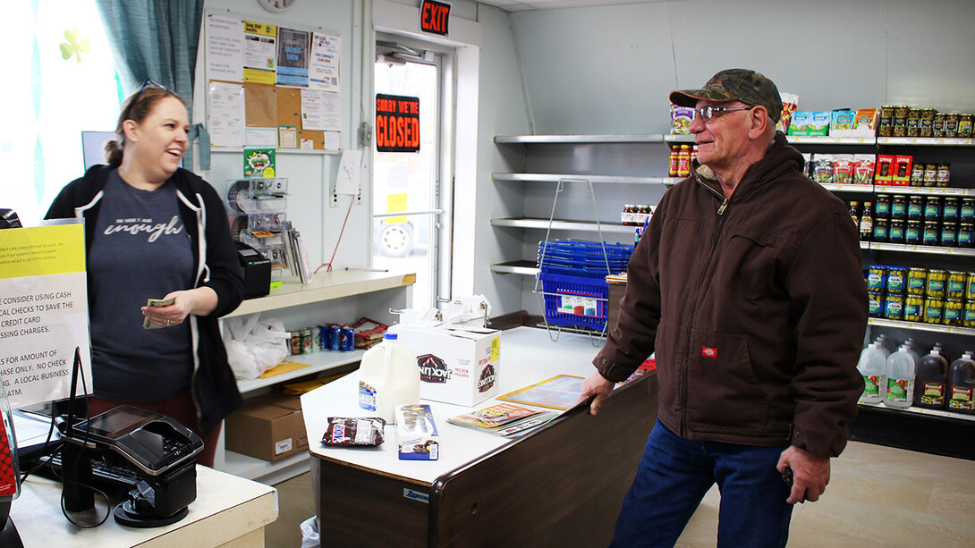 Volunteers from Lynch help unload groceries from the delivery truck.