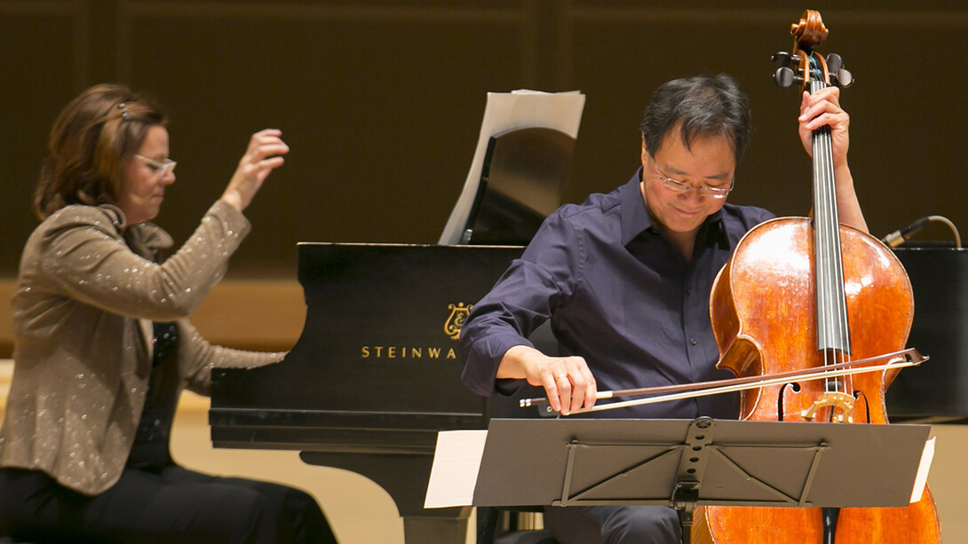 Kathryn Stott plays piano next to Yo-Yo Ma playing cello