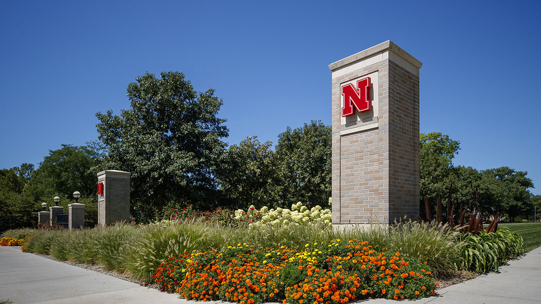 East Campus gateway with lush landscaping in front