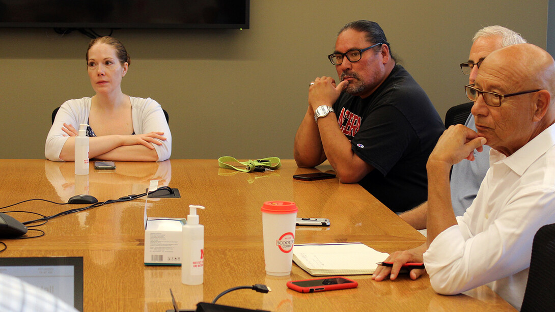 Theresa Rachel (left), Mike Grant (center) and Ted Hibbeler (right) discuss details of the USDA grant in Nebraska’s Agricultural Hall.