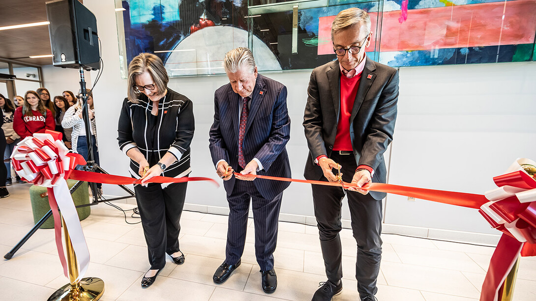 (From left) Sherri Jones, dean of the College of Education and Human Sciences; Rick Edwards, administrator and professor emeritus and Carolyn Pope Edwards’ widower; and Chancellor Ronnie Green cut the ribbon during the opening of Carolyn Pope Edwards Hall on Sept. 29.