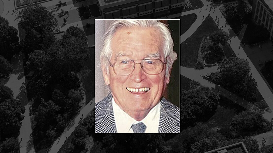 Color portrait of Dale L. Gibbs on black campus background