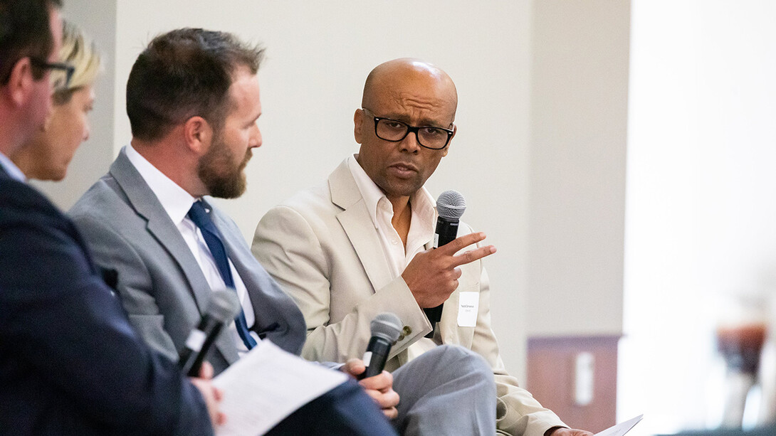 Yacob Zereyesus, senior economist with the U.S. Department of Agriculture’s Economic Research Service (right) speaks at the Yeutter Institute symposium at Nebraska Innovation Campus as a panel analyzed trade effects from the conflict in Ukraine. The other panelists (from left) were Jason Grant, professor and director of the Center for Agricultural Trade at Virginia Tech University; Katrin Kuhlmann, Georgetown University law professor and faculty co-director for the university’s Center on Inc