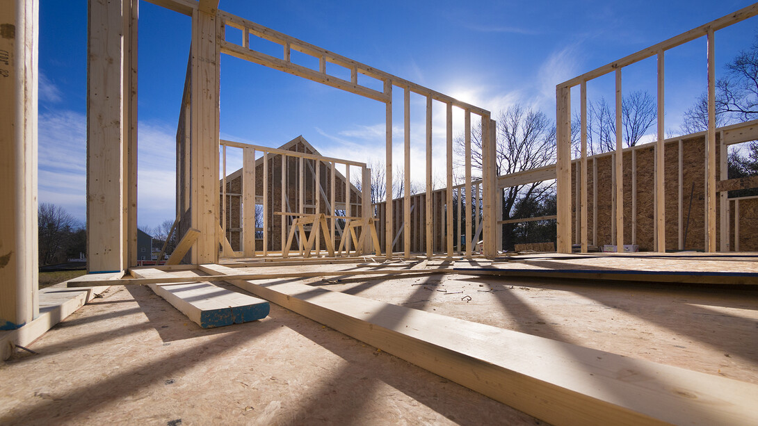 Construction site with frame of house