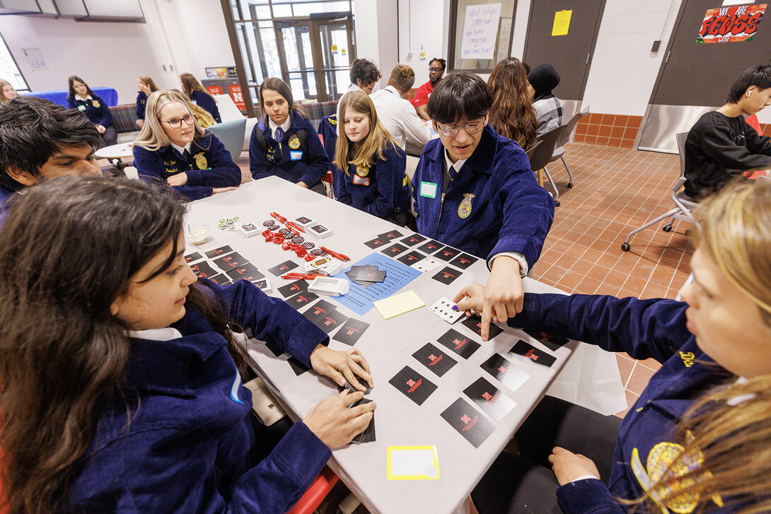 FFA members sit at tables.