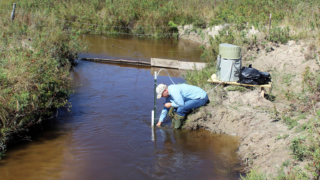 A University of Nebraska–Lincoln researcher takes groundwater samples from the Loup River in Nebraska’s Sandhills in September 2018.