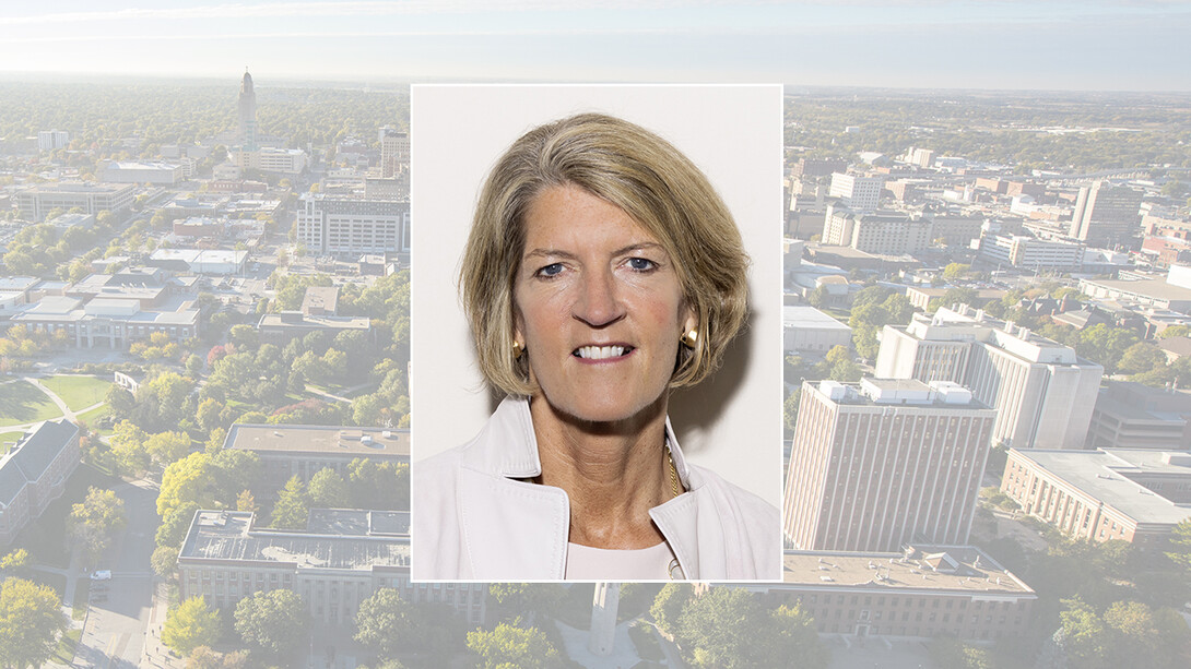 Color portrait of Beth Ford on color campus background