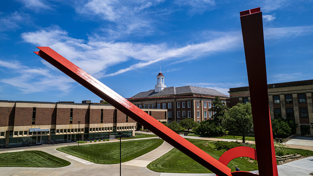 View of Love Library with Old Glory sculpture in foreground