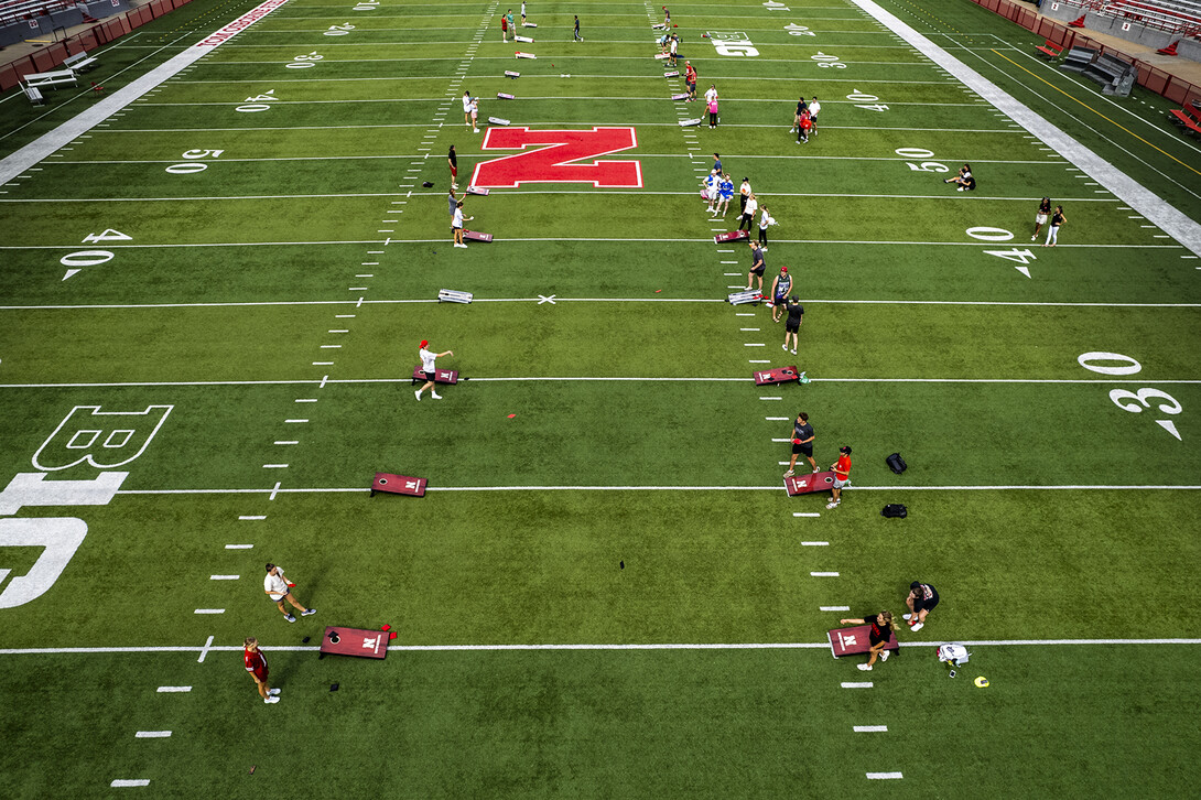 Husker students compete in the homecoming cornhole tournament at Memorial Stadium in September 2021.