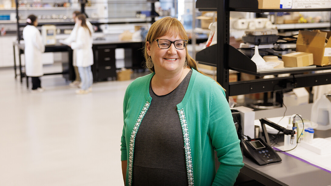 Shannon Bartelt-Hunt stands in a lab.