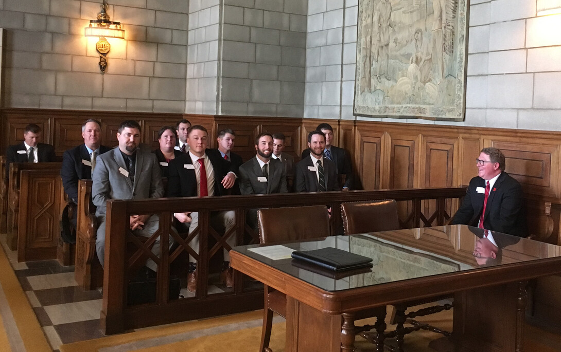 Terry Hejny sits with members of the LEAD 37 class in the hearing room for the Nebraska Supreme Court.