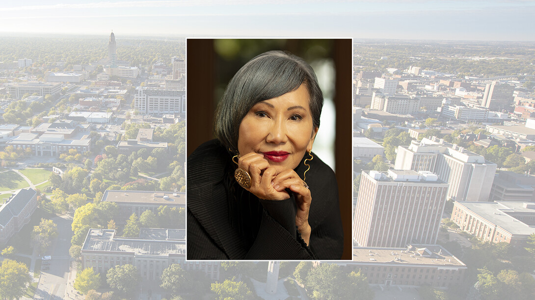 Color portrait of Amy Tan on color campus background