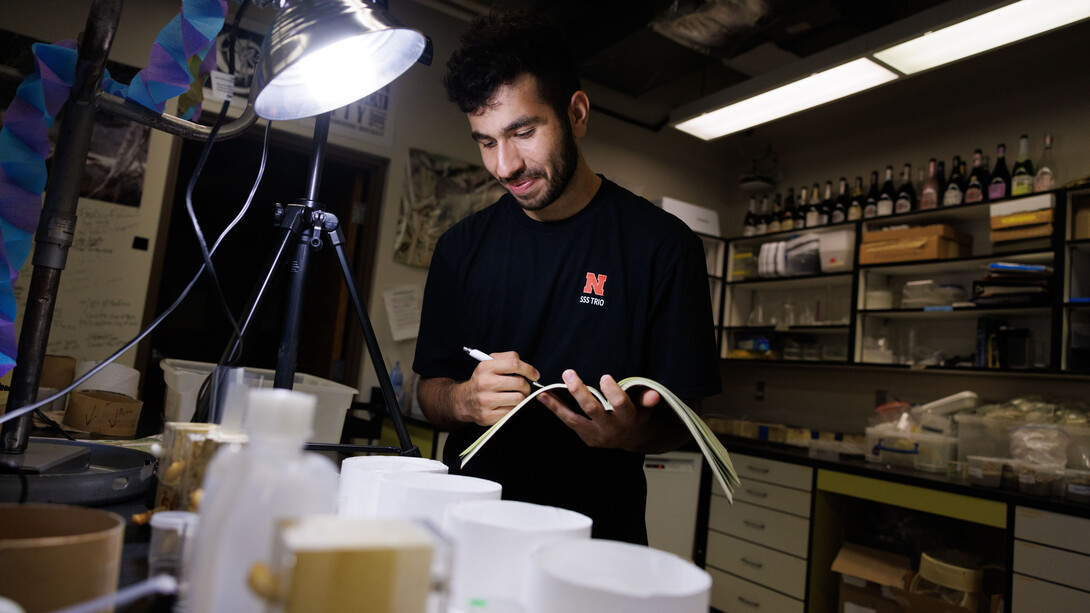 Abdallah Abdallah documents a spider’s activity while working in Eileen Hebets’ lab in 2023.