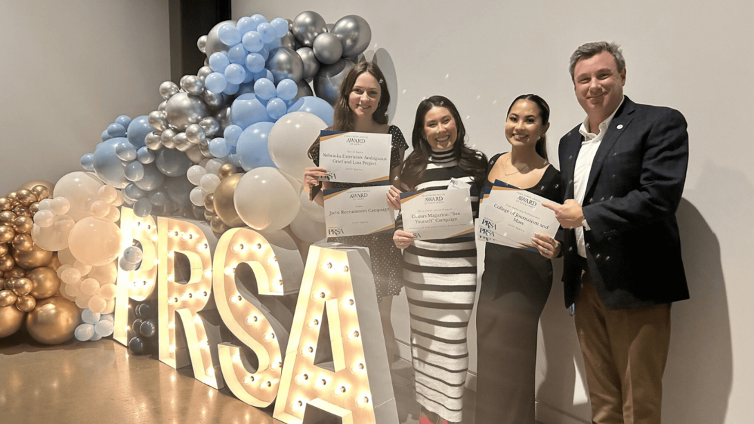  Paper Anvil Award winners and College of Journalism and Mass Communications students (from left) Madalyn Backes, Ryann Zechmann and Erica Napuli pose for a photo with Truescope President Todd Murphy.