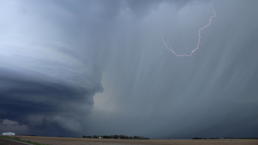 A lightning bolt crackles in a storm cloud.