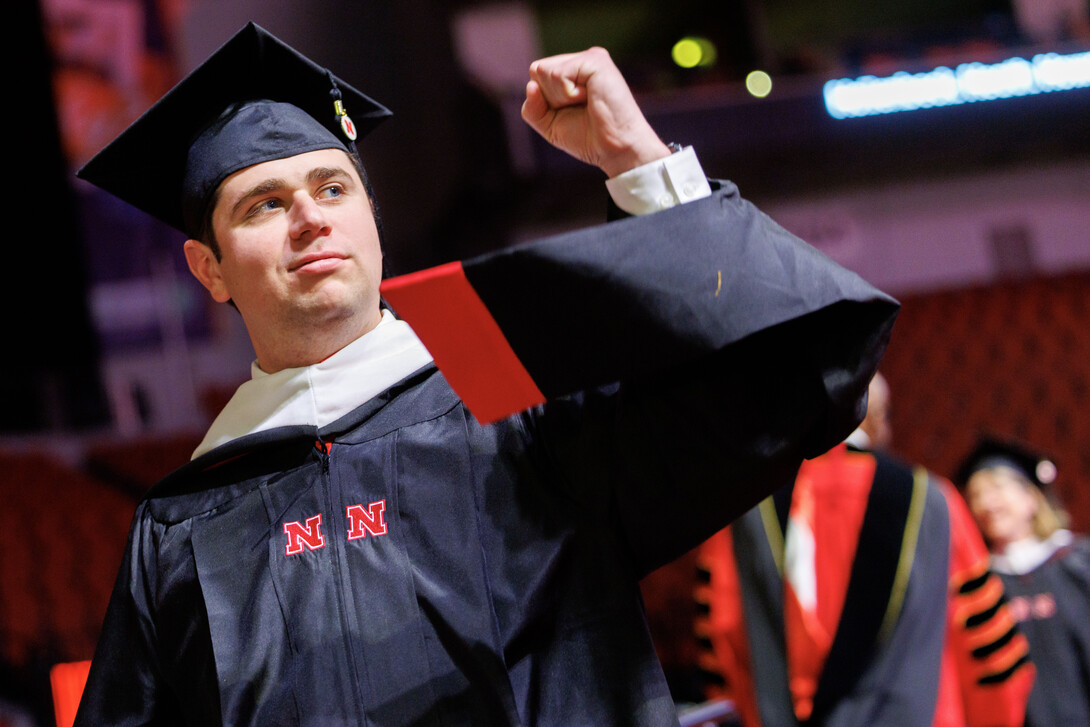 Heath Howard of Wylie, Texas, pumps his fist after receiving his Master of Arts.