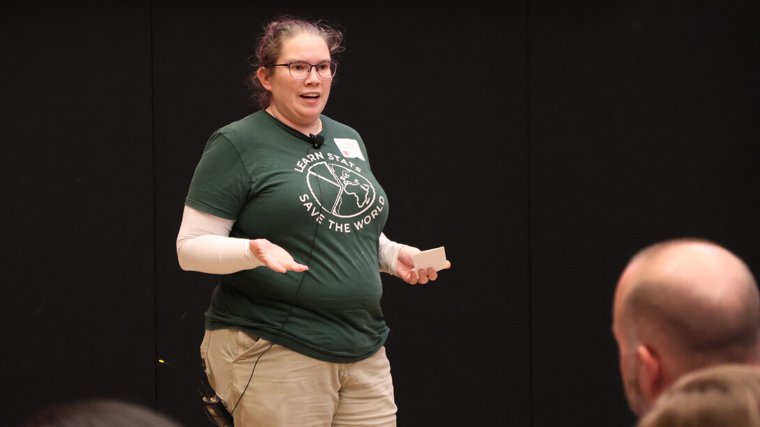 Susan VanderPlas, associate professor of statistics, speaks to a crowd.