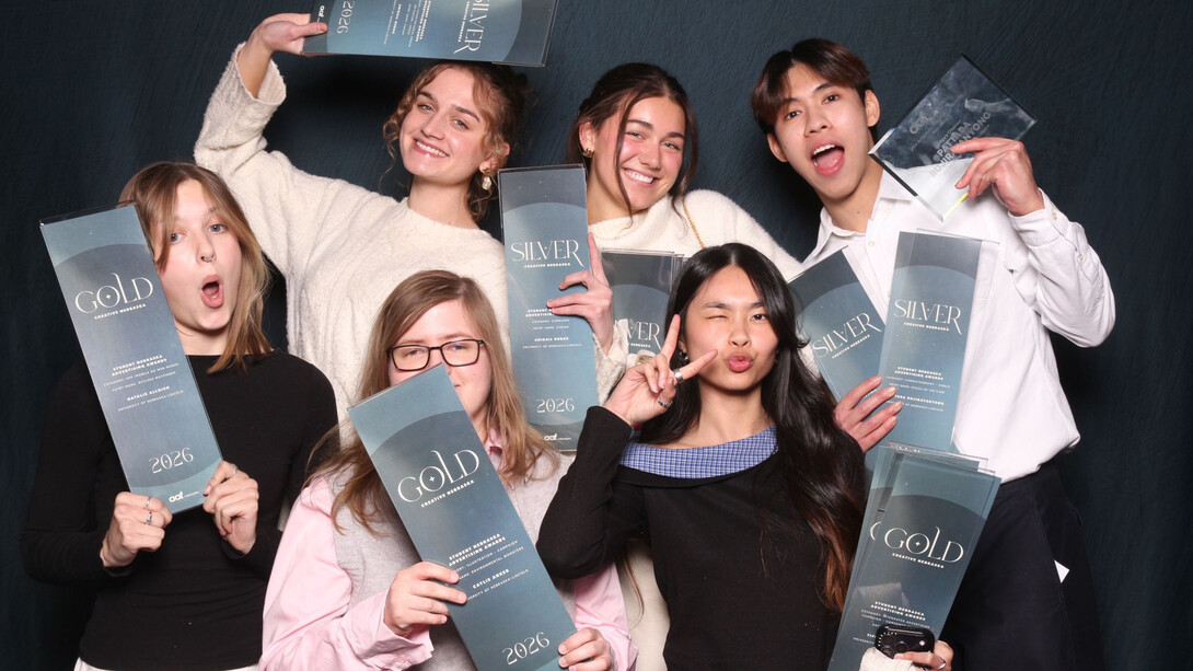 Graphic design students pose with awards. Clockwise from upper left, they are: Abigail Bubak, Clare Clark, Pattara Rujirayanyong, Tiffany Nguyen, Caylie Anker and Natalie Allrich.