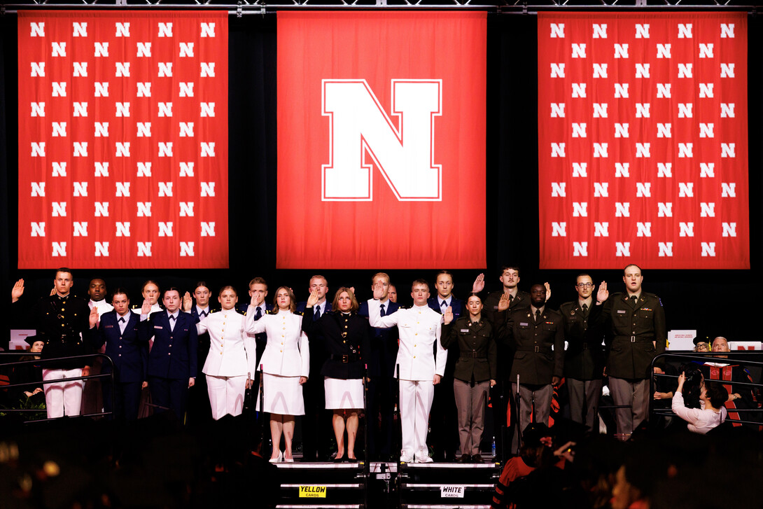 ROTC members in uniform recite the oath of enlistment onstage at Pinnacle Bank Arena.
