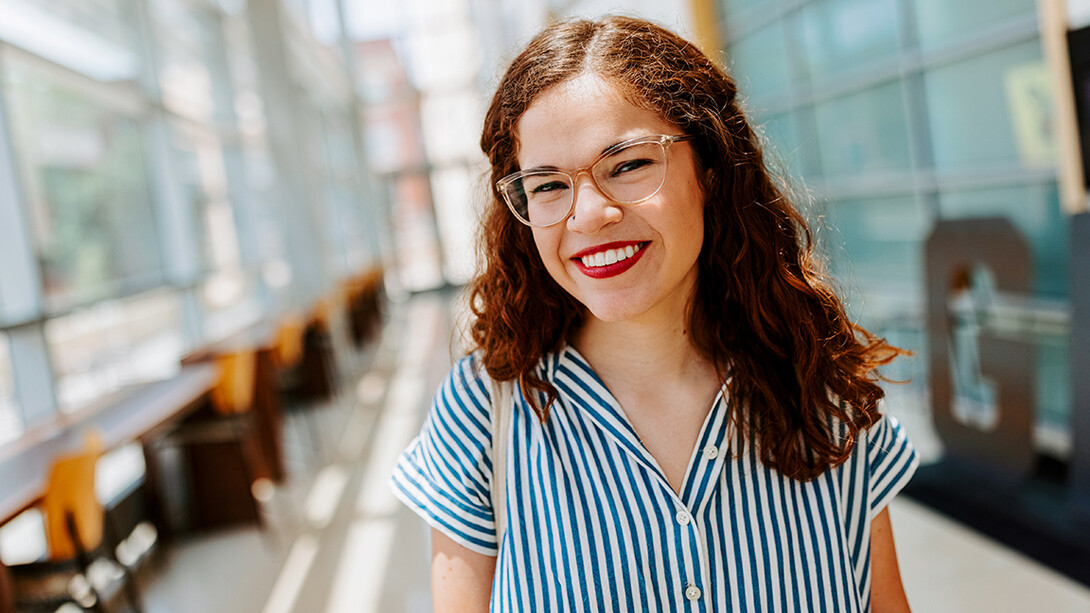 Photo of Taylor Jarvis in Hawks Hall, which is home to the College of Business.