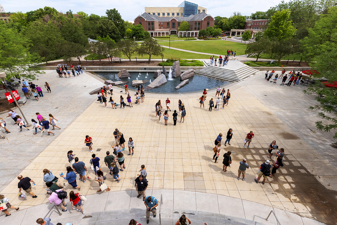 Parents and incoming students break into groups on the Nebraska Union Plaza as the afternoon session of New Student Enrollment begins on June 24.