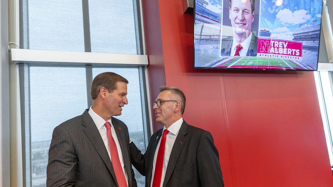Chancellor Ronnie Green and Trev Alberts chat before the July 14 announcement in Memorial Stadium.